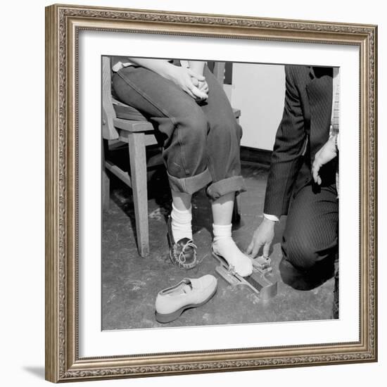 Salesmen Helps Woman with Safety Work Shoes, Ca. 1943-null-Framed Photographic Print