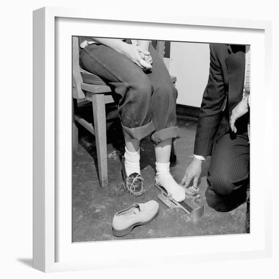 Salesmen Helps Woman with Safety Work Shoes, Ca. 1943-null-Framed Photographic Print