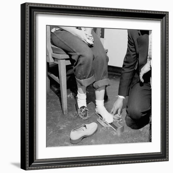 Salesmen Helps Woman with Safety Work Shoes, Ca. 1943-null-Framed Photographic Print