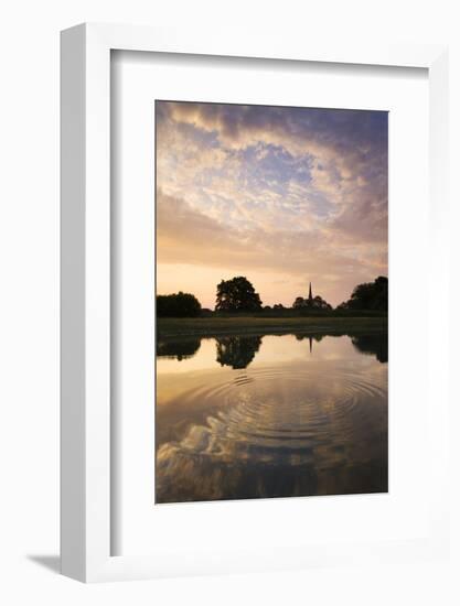 Salisbury Cathedral Spire and a beautiful dawn sky reflected in a rippled pond, Salisbury, Wiltshir-Adam Burton-Framed Photographic Print