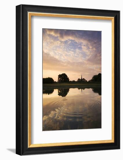 Salisbury Cathedral Spire and a beautiful dawn sky reflected in a rippled pond, Salisbury, Wiltshir-Adam Burton-Framed Photographic Print