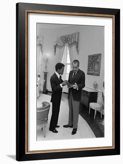 Sammy Davis Jr. with Richard Nixon in the Oval Office. March 4 1973-null-Framed Photo