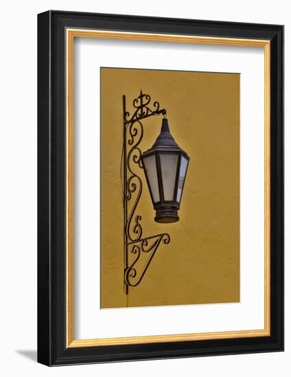 San Miguel De Allende, Mexico. Lantern and shadow on colorful buildings-Darrell Gulin-Framed Photographic Print