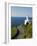 San Sebastian Bay Clifftop Lighthouse with Cyclist Riding Uphill-Christian Kober-Framed Photographic Print