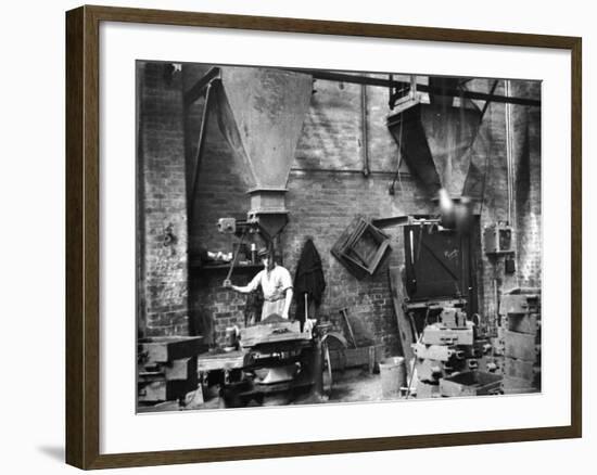 Sand Being Sifted by Worker Into Molds in Factory-Emil Otto Hoppé-Framed Photographic Print