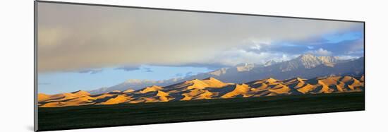 Sand Dunes in a Desert with a Mountain Range in the Background-null-Mounted Photographic Print