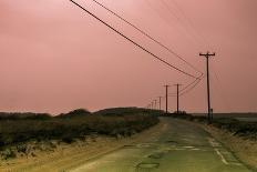 Old Curved Road through Deserted Coastline at Sunset under a Soft Pink Sky-Sanghwan Kim-Photographic Print