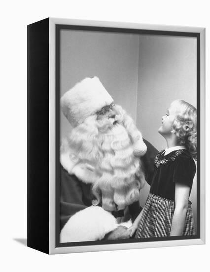 Santa Claus and 5 Year Old Demonstrating Right Way to Hold Child-Martha Holmes-Framed Premier Image Canvas