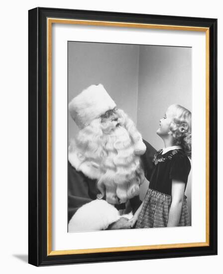 Santa Claus and 5 Year Old Demonstrating Right Way to Hold Child-Martha Holmes-Framed Photographic Print