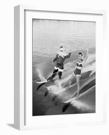 Santa Claus Water Skiing with Female Friend-null-Framed Photographic Print