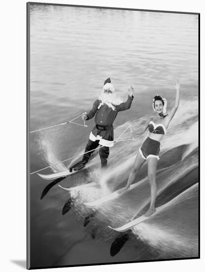 Santa Claus Water Skiing with Female Friend-null-Mounted Photographic Print