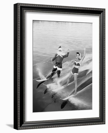 Santa Claus Water Skiing with Female Friend-null-Framed Photographic Print