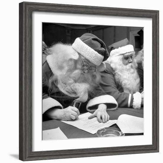 Santa Clauses Take a Written Examination For Diploma After Listening to Lectures-Martha Holmes-Framed Photographic Print