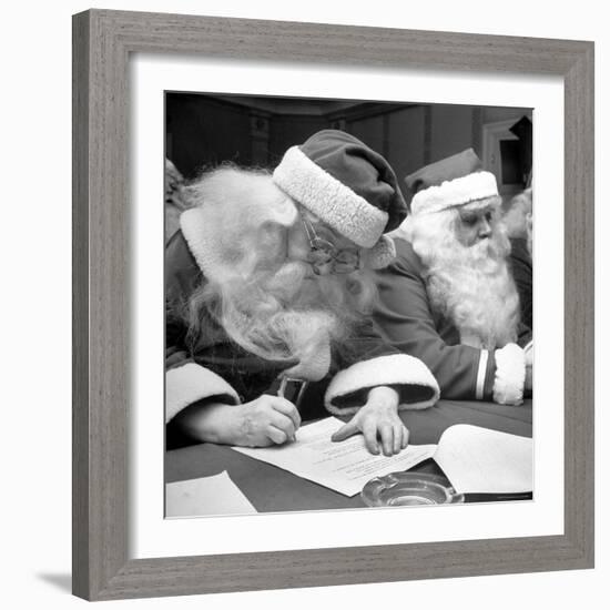 Santa Clauses Take a Written Examination For Diploma After Listening to Lectures-Martha Holmes-Framed Photographic Print