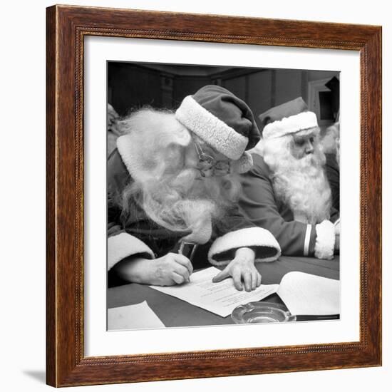 Santa Clauses Take a Written Examination For Diploma After Listening to Lectures-Martha Holmes-Framed Photographic Print