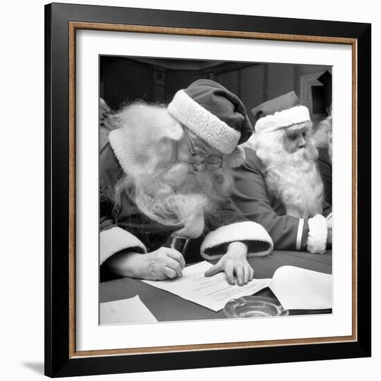 Santa Clauses Take a Written Examination For Diploma After Listening to Lectures-Martha Holmes-Framed Photographic Print