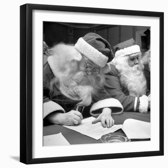 Santa Clauses Take a Written Examination For Diploma After Listening to Lectures-Martha Holmes-Framed Photographic Print