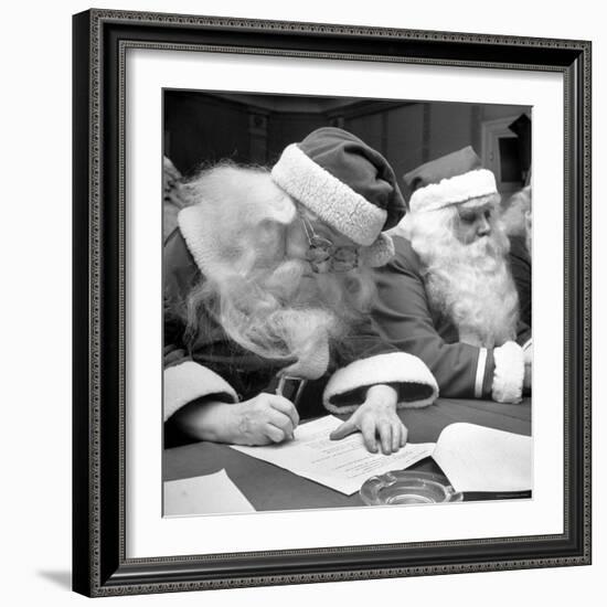 Santa Clauses Take a Written Examination For Diploma After Listening to Lectures-Martha Holmes-Framed Photographic Print