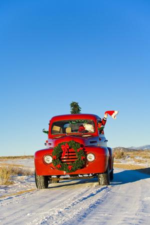Santa Driving A Vintage Red Ford Pick Up Truck Down A Snowcovered Rural Road Photographic Print By Design Pics Inc Artcom