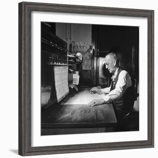 Santa Fe Railroad Dispatcher Working on a Freight Train-Bernard Hoffman-Framed Photographic Print