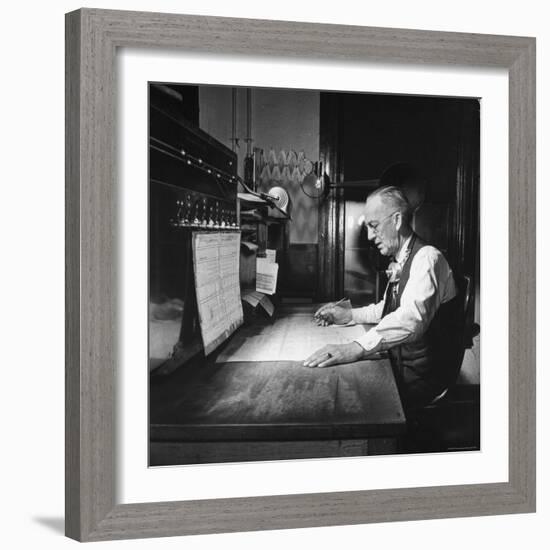 Santa Fe Railroad Dispatcher Working on a Freight Train-Bernard Hoffman-Framed Photographic Print