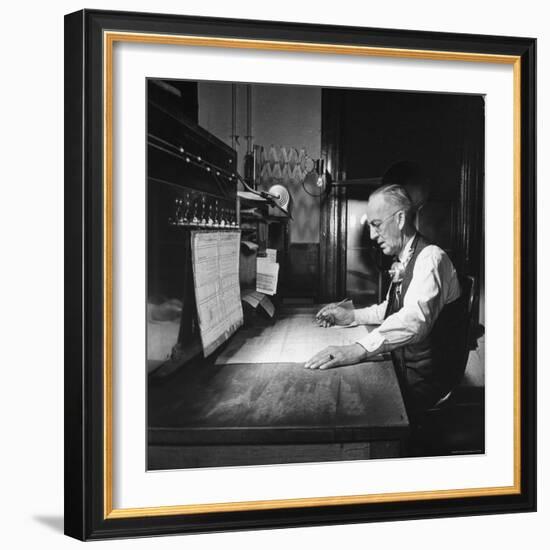 Santa Fe Railroad Dispatcher Working on a Freight Train-Bernard Hoffman-Framed Photographic Print