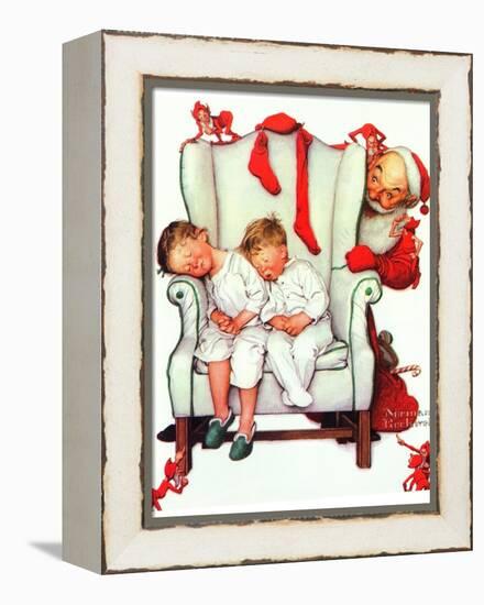 Santa Looking at Two Sleeping Children (or Santa Filling the Stockings)-Norman Rockwell-Framed Premier Image Canvas