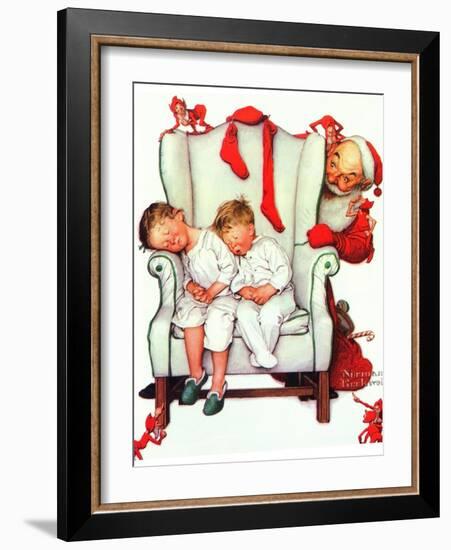 Santa Looking at Two Sleeping Children (or Santa Filling the Stockings)-Norman Rockwell-Framed Giclee Print