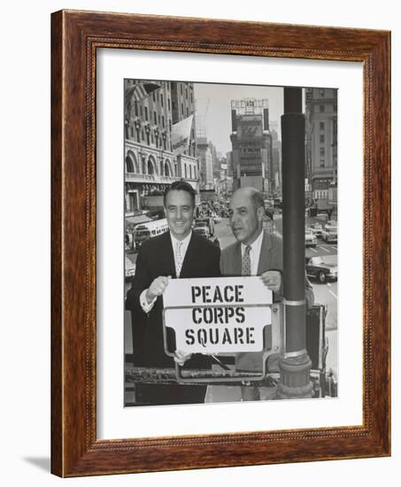 Sargent Shriver and Edward R. Dudley in Times Square with a Sign 'Peace Corps Square'-null-Framed Photo