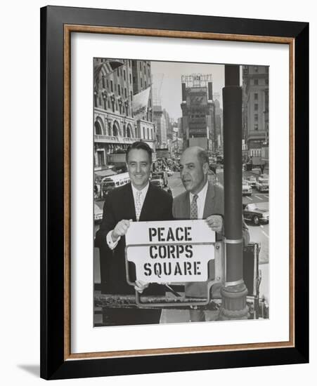 Sargent Shriver and Edward R. Dudley in Times Square with a Sign 'Peace Corps Square'-null-Framed Photo