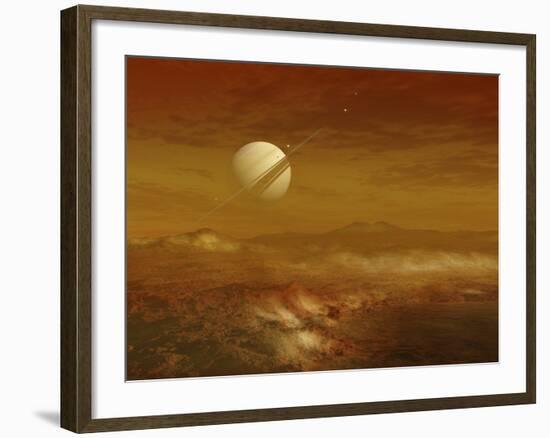 Saturn Above the Thick Atmosphere of its Moon Titan-Stocktrek Images-Framed Photographic Print