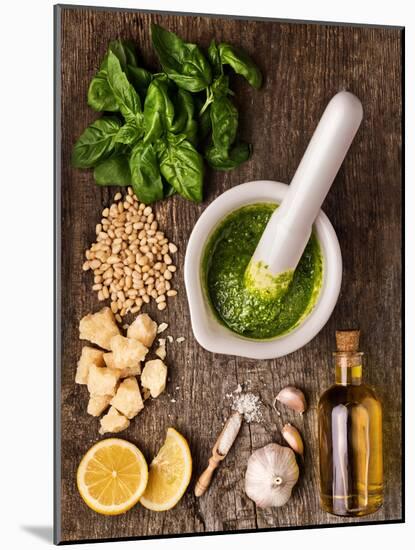 Sauce Pesto and its Ingredients on Rough Wood-Andrii Gorulko-Mounted Photographic Print