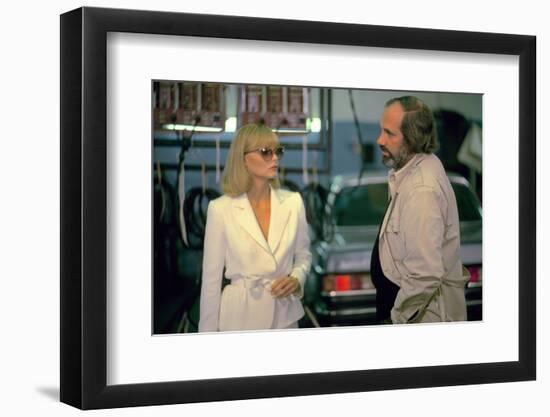 SCARFACE, 1983 directed by BRIAN by PALMA On the set, Michelle Pfeiffer with the director, Brian by-null-Framed Photo