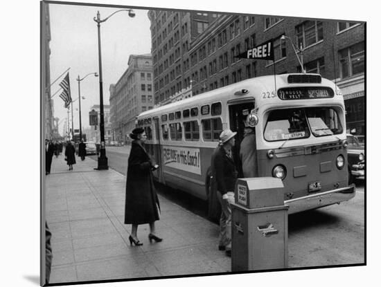 Scene from Seattle During Free Ride Day, with People Boarding a Bus-null-Mounted Photographic Print