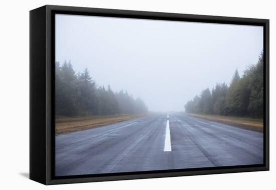 Scenic Image Of A Airplane Runway On The Oregon Coast-Justin Bailie-Framed Premier Image Canvas