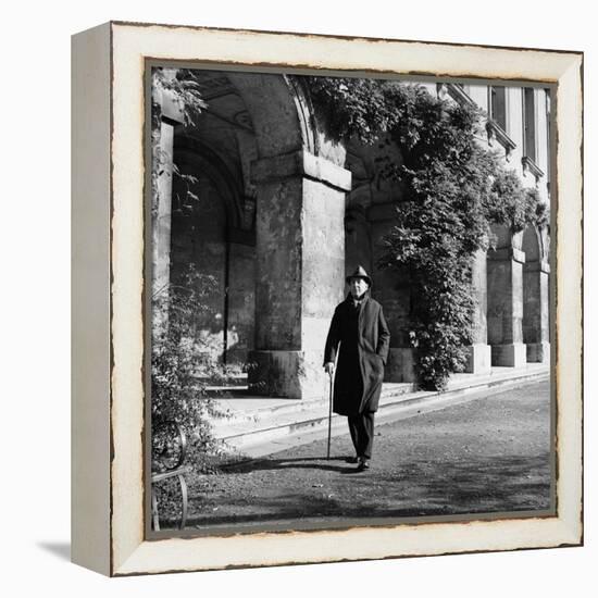 Scholar C.S. Lewis Walking with Cane Near Building at Magdalen College, Oxford University-Hans Wild-Framed Premier Image Canvas