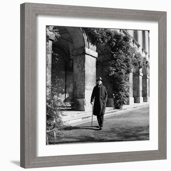 Scholar C.S. Lewis Walking with Cane Near Building at Magdalen College, Oxford University-Hans Wild-Framed Premium Photographic Print