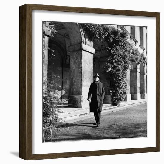 Scholar C.S. Lewis Walking with Cane Near Building at Magdalen College, Oxford University-Hans Wild-Framed Premium Photographic Print