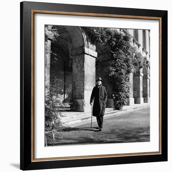 Scholar C.S. Lewis Walking with Cane Near Building at Magdalen College, Oxford University-Hans Wild-Framed Premium Photographic Print