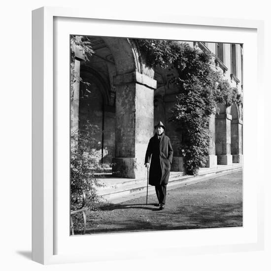 Scholar C.S. Lewis Walking with Cane Near Building at Magdalen College, Oxford University-Hans Wild-Framed Premium Photographic Print