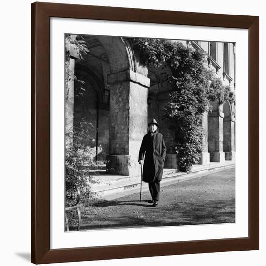 Scholar C.S. Lewis Walking with Cane Near Building at Magdalen College, Oxford University-Hans Wild-Framed Premium Photographic Print