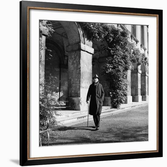 Scholar C.S. Lewis Walking with Cane Near Building at Magdalen College, Oxford University-Hans Wild-Framed Premium Photographic Print