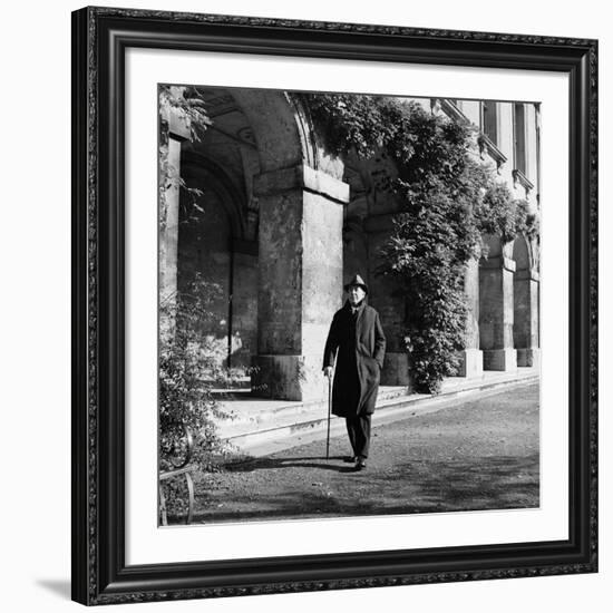 Scholar C.S. Lewis Walking with Cane Near Building at Magdalen College, Oxford University-Hans Wild-Framed Premium Photographic Print