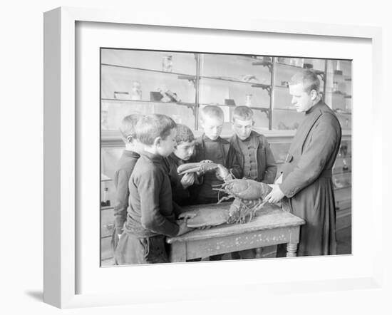 School For Fishing: Monk Shows How to Handle a Lobster, 20th Century-Andrew Pitcairn-knowles-Framed Giclee Print