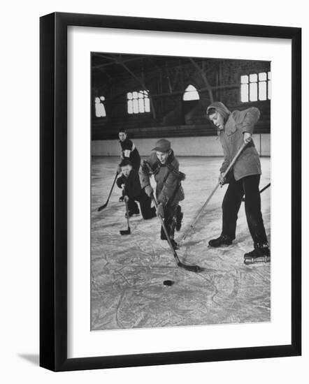 Schoolboys Playing Ice Hockey--Framed Photographic Print