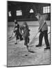 Schoolboys Playing Ice Hockey-null-Mounted Photographic Print