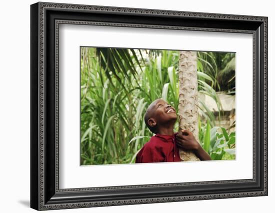 Schoolchild Embracing Tree Trunk and Looking Up, Bujumbura, Burundi-Anthony Asael-Framed Photographic Print