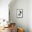 Schubert-Gary Brown-Framed Premier Image Canvas displayed on a wall