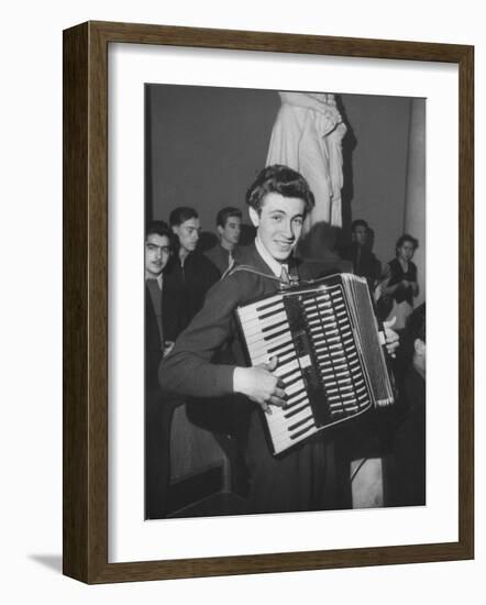 Science Student Playing the Accordian-Ed Clark-Framed Photographic Print