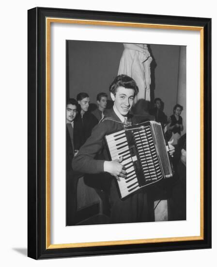 Science Student Playing the Accordian-Ed Clark-Framed Photographic Print